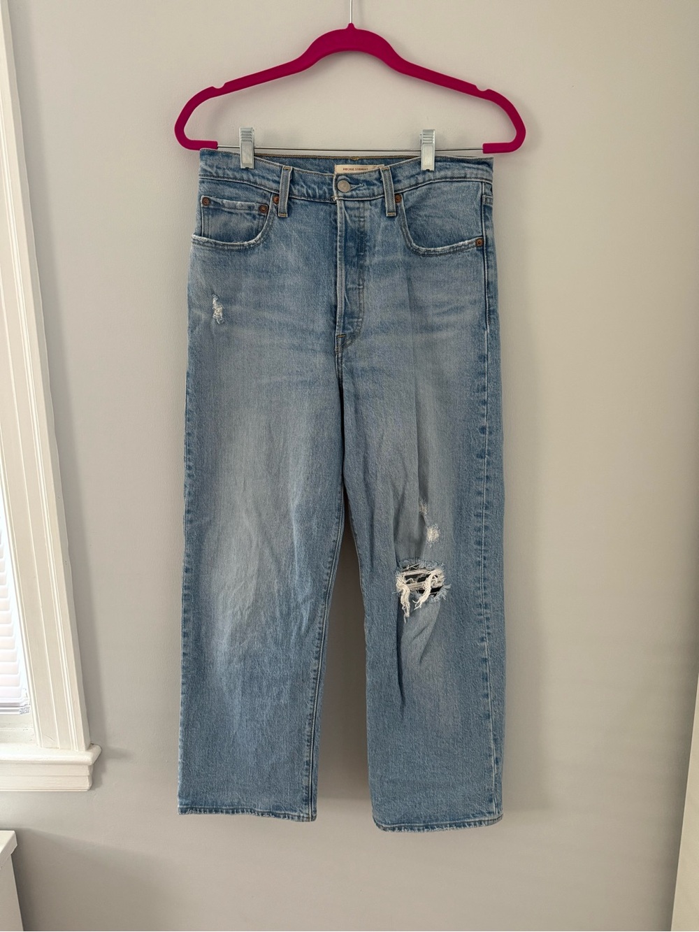 Levi's High-Waisted Ribcage Light Wash Straight Leg Jeans with Distressed Knee